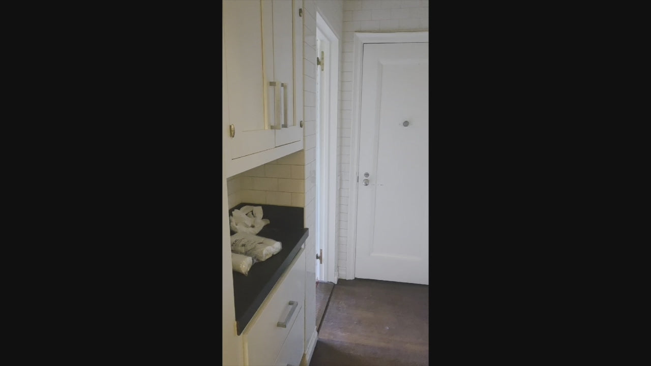 Load video: Premier Custom-Built Transitional White Butler's Pantry with Sub-Zero Refrigeration