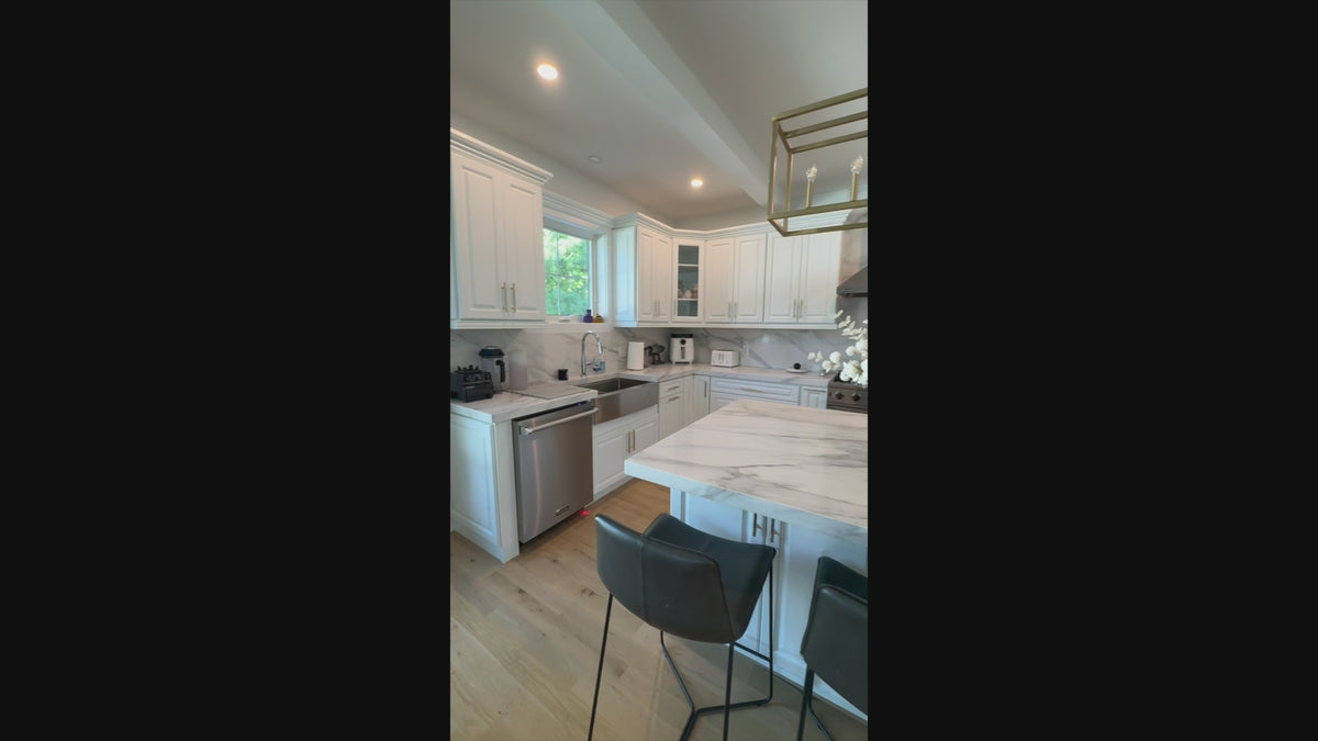 Load video: Cubitac transitional white custom kitchen suite with center island and Viking appliances