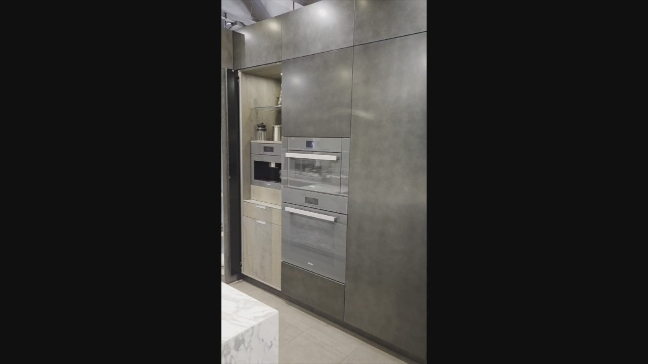 Load video: eggersmann USA Chablis Vintage Oak &amp; Steel Grey Modern Kitchen with Arabescato Waterfall Island and Miele Appliance Suite