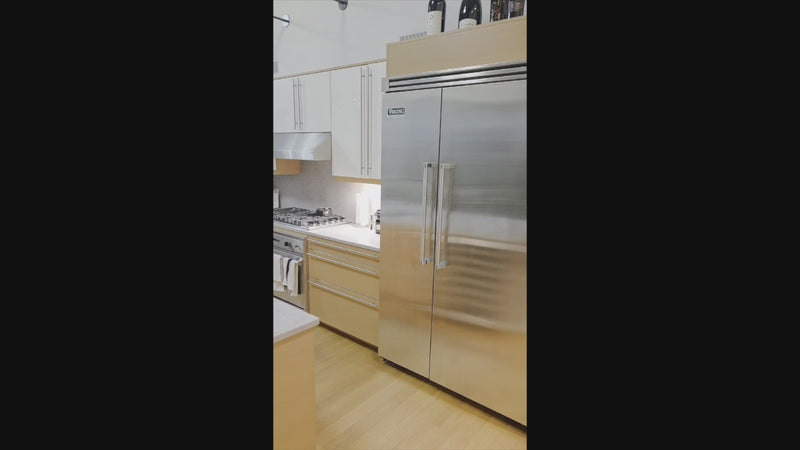 High-end German kitchen suite by Poggenpohl featuring Viking range and refrigeration