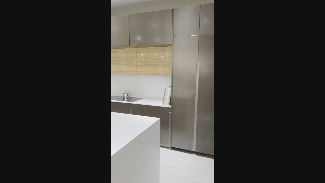 Load video: Composit Modern Brown Kitchen with Waterfall Island, Stone Countertops and Wolf &amp; Sub-Zero Appliances