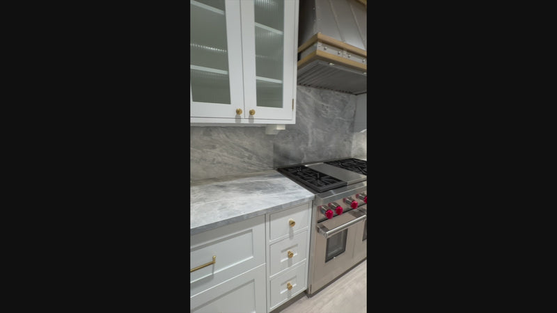 Close up view of the Sub-Zero 648PROG 48 inch stainless steel professional refrigerator in an open luxury kitchen layout