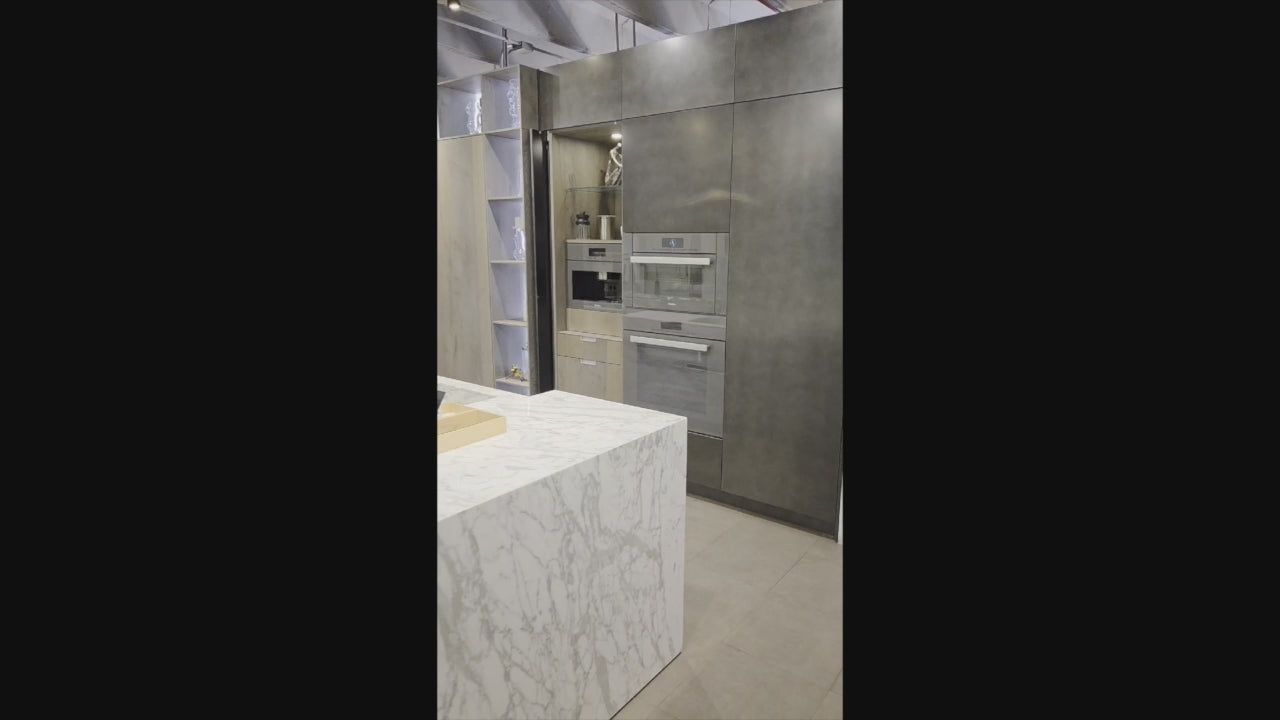 Load video: eggersmann USA Chablis Vintage Oak &amp; Steel Grey Modern Kitchen with Arabescato Waterfall Island and Miele Appliance Suite
