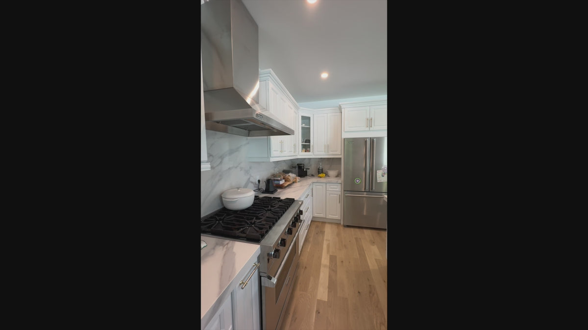 Load video: Luxury architectural estate kitchen cabinetry with professional stainless steel range