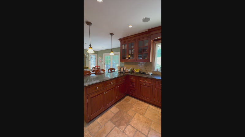 Complete luxury showroom display kitchen with raised panel wood cabinetry