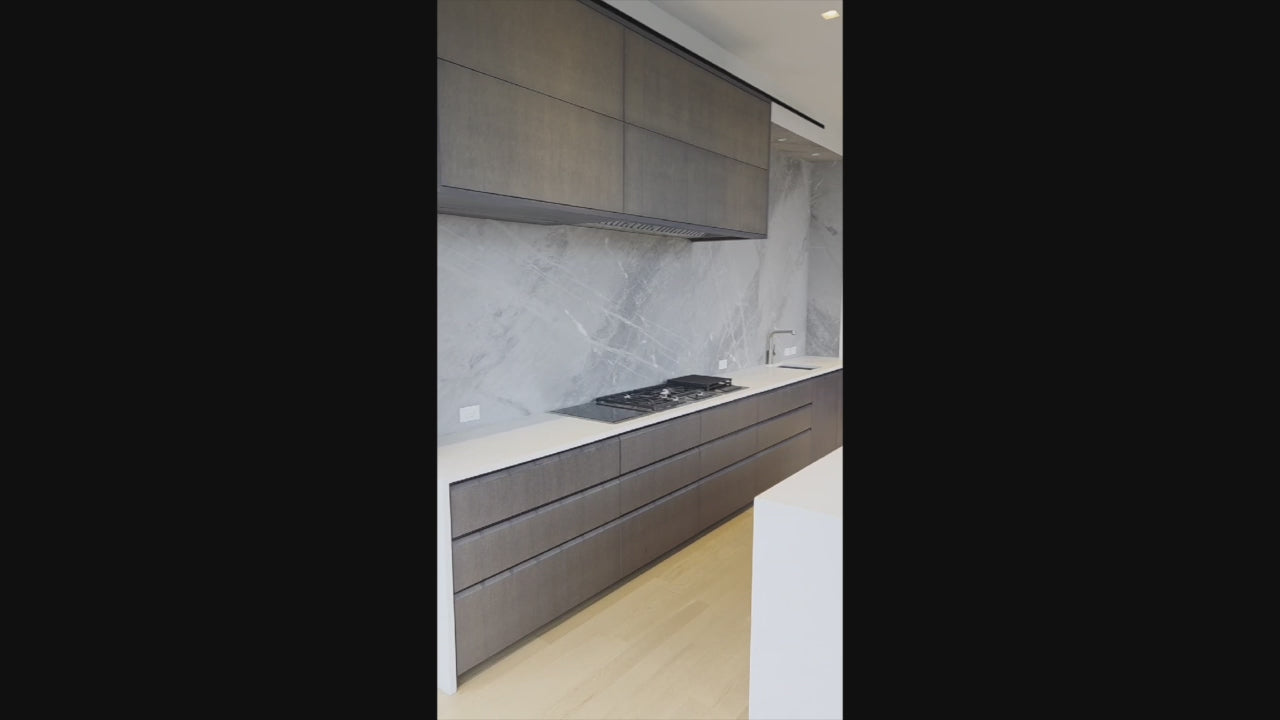 Load video: Custom Modern Wood Veneer Kitchen with White Marble Countertops and Wolf &amp; Miele Appliances