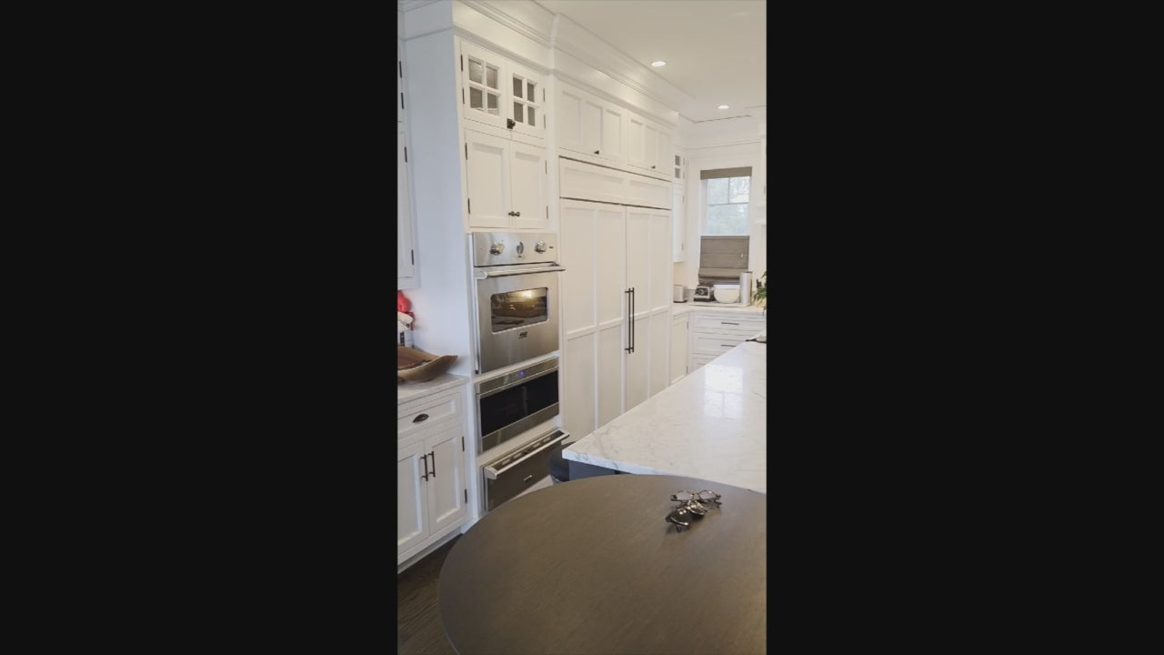 Load video: "The Prescott" transitional white kitchen with large island and Viking appliances