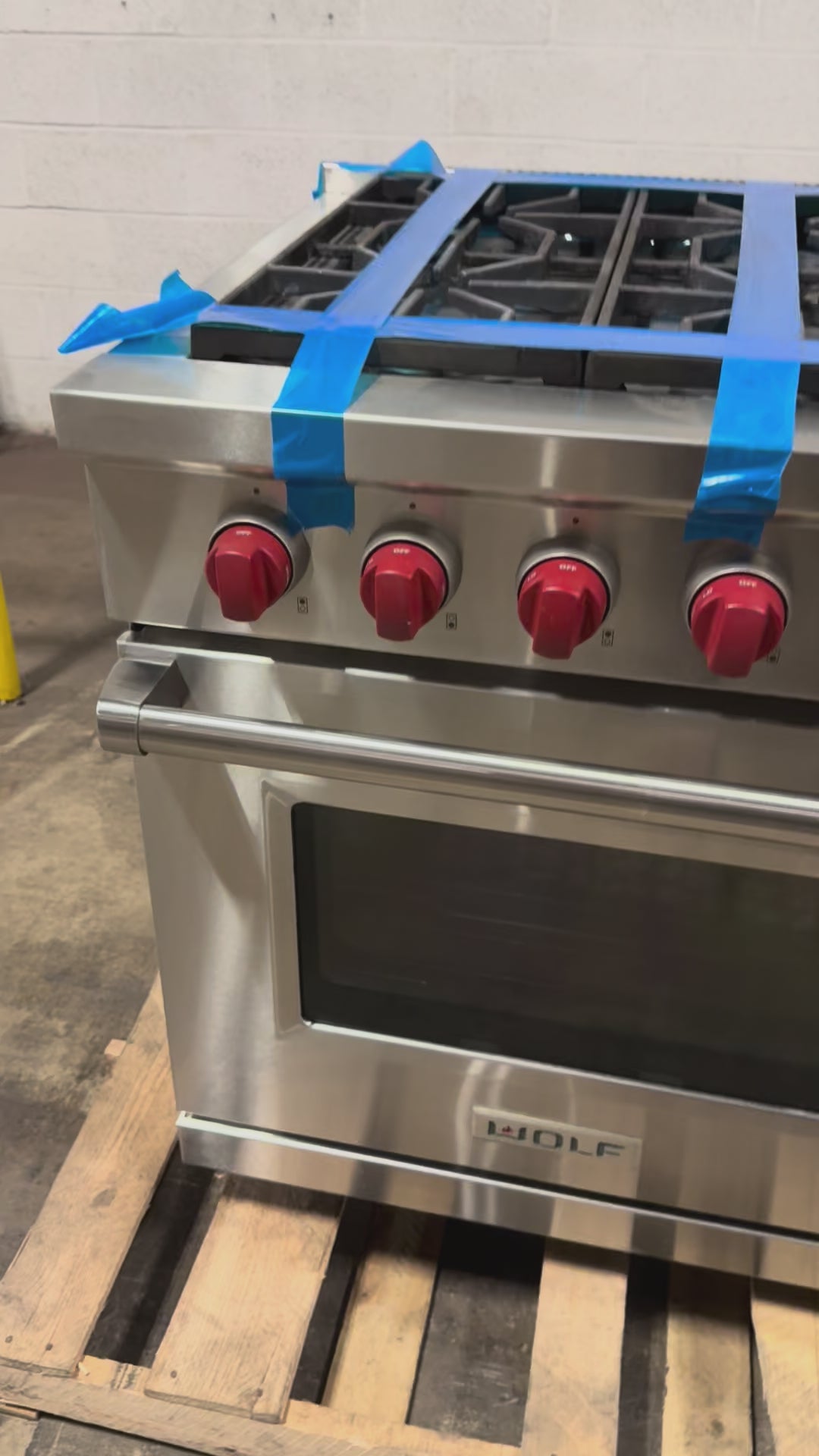 Load video: Wolf DF606CG LP 60 inch professional dual fuel range front view stainless steel 6 burners and grill
