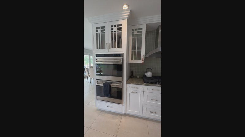 High-end traditional white kitchen perimeter cabinets and architectural island view