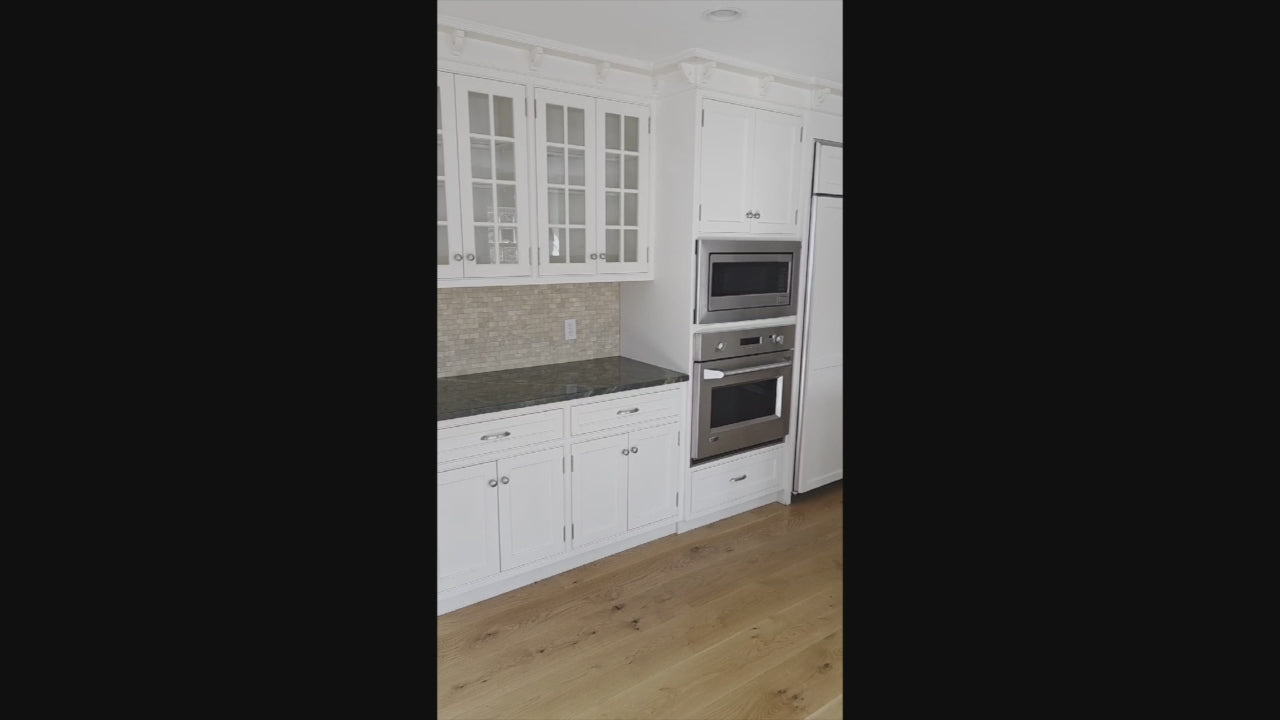 Load video: “The Providence” Custom Traditional White Kitchen with Wood Top Island &amp; Monogram Appliances