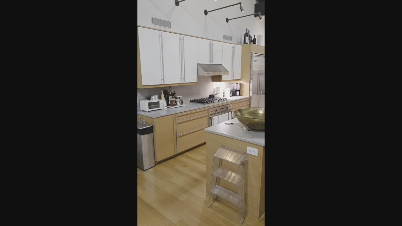 Load video: Poggenpohl modern wood veneer kitchen with Viking professional appliances