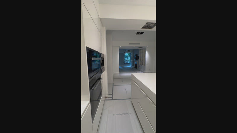 High-end residential custom millwork cabinetry in contemporary white gloss