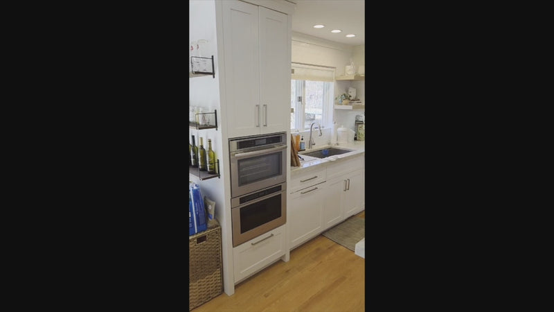 Luxury white kitchen suite by Cuiffo featuring professional JennAir appliances