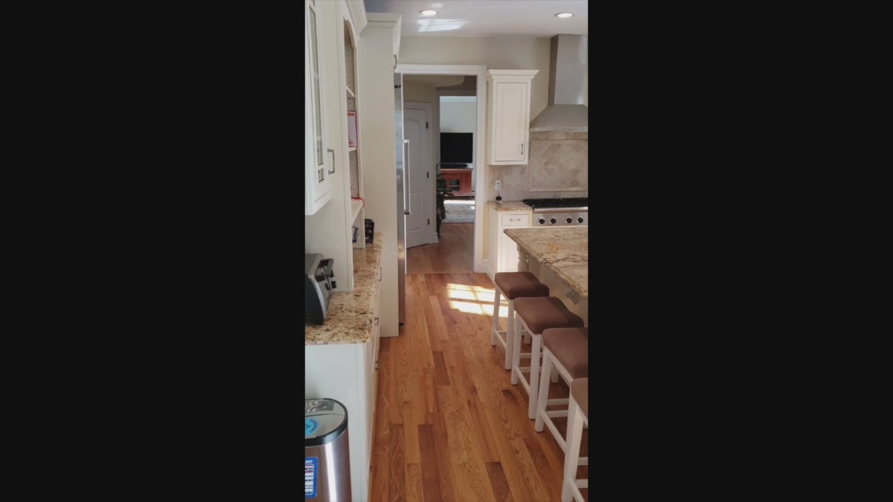 Load video: Traditional Light Cream Kitchen with Island, Granite Countertops and Appliances