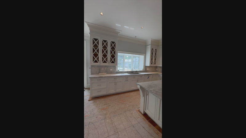 Luxury custom white kitchen suite with integrated professional refrigeration