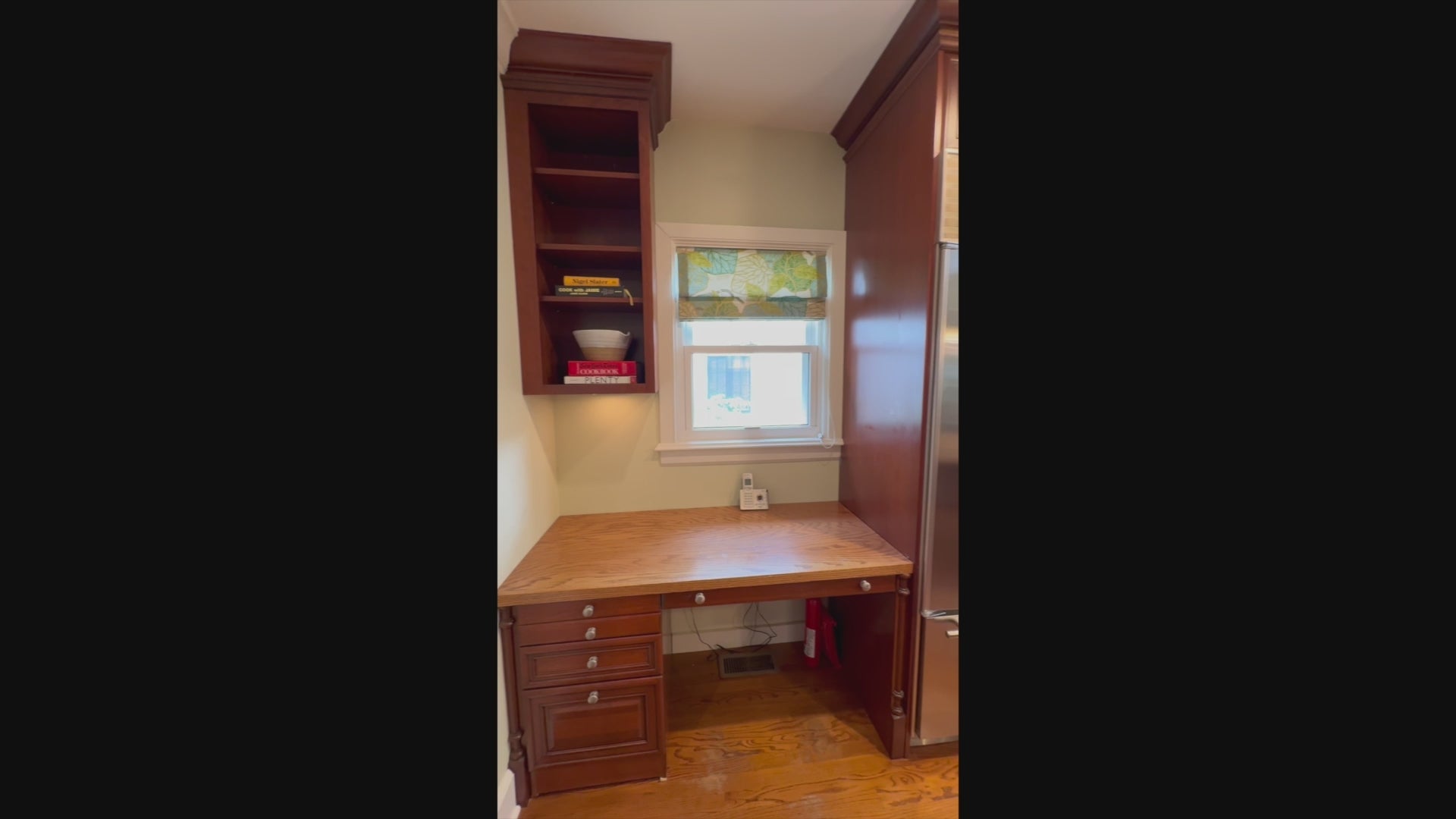 Load video: Brookhaven traditional wooden kitchen with central island and Sub-Zero refrigerator
