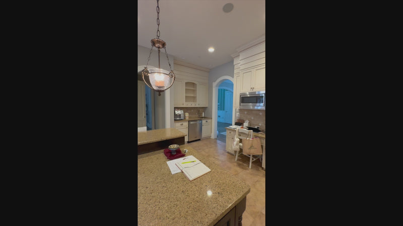 Luxury showroom display dual tone kitchen layout with white perimeter and dark island