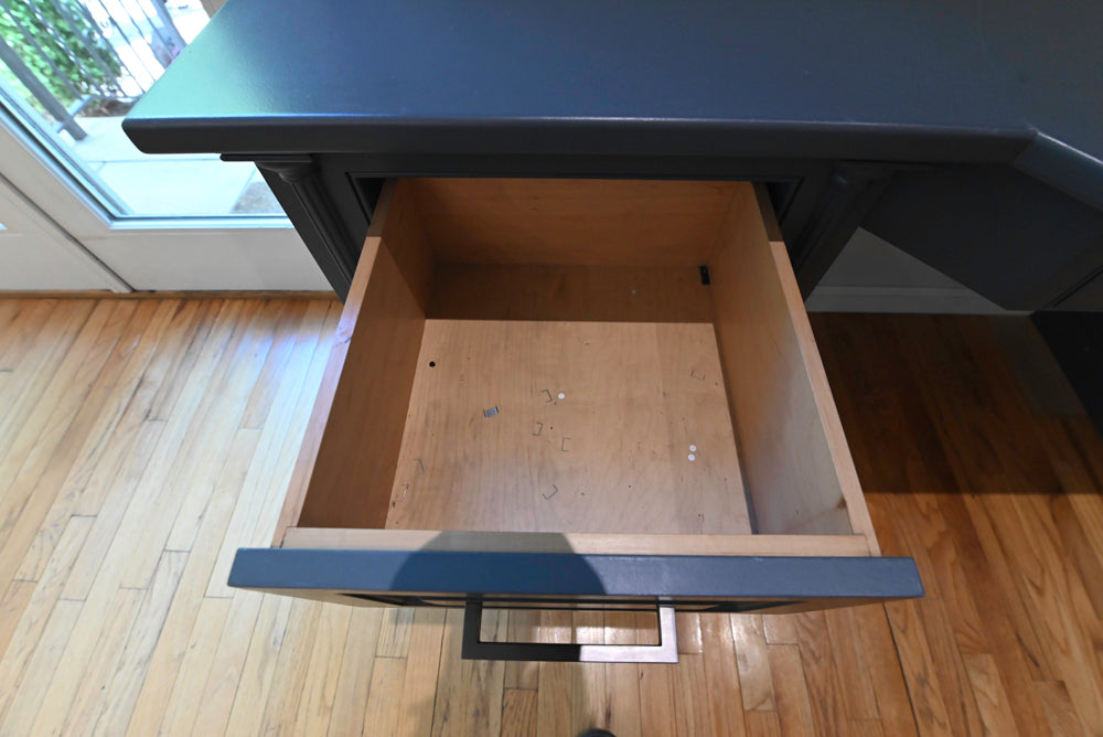 Luxury custom blue home office cabinetry run with integrated desk surface